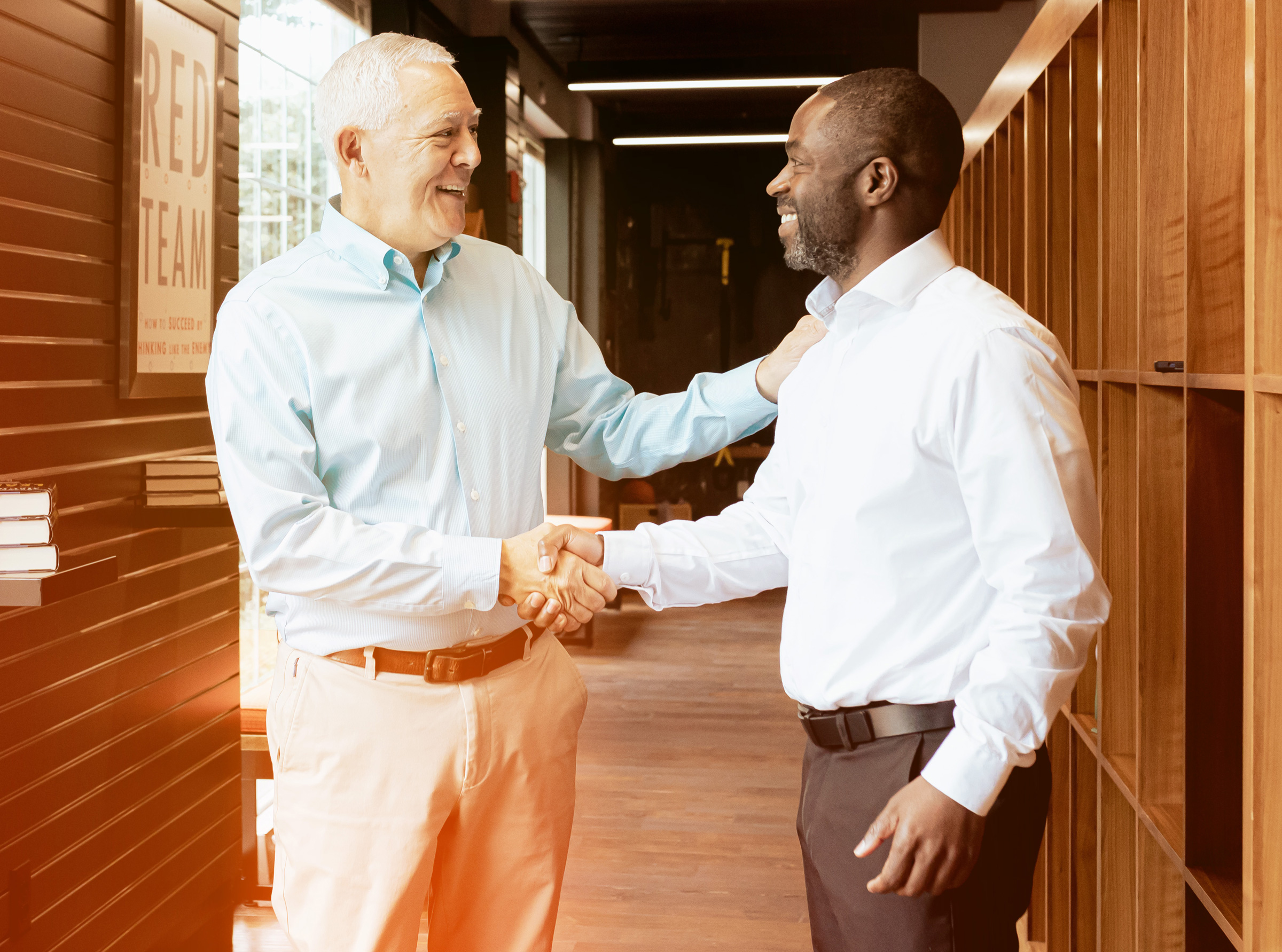 McChrystalGroup-Contact.jpg Two Men Shaking Hands and Smiling