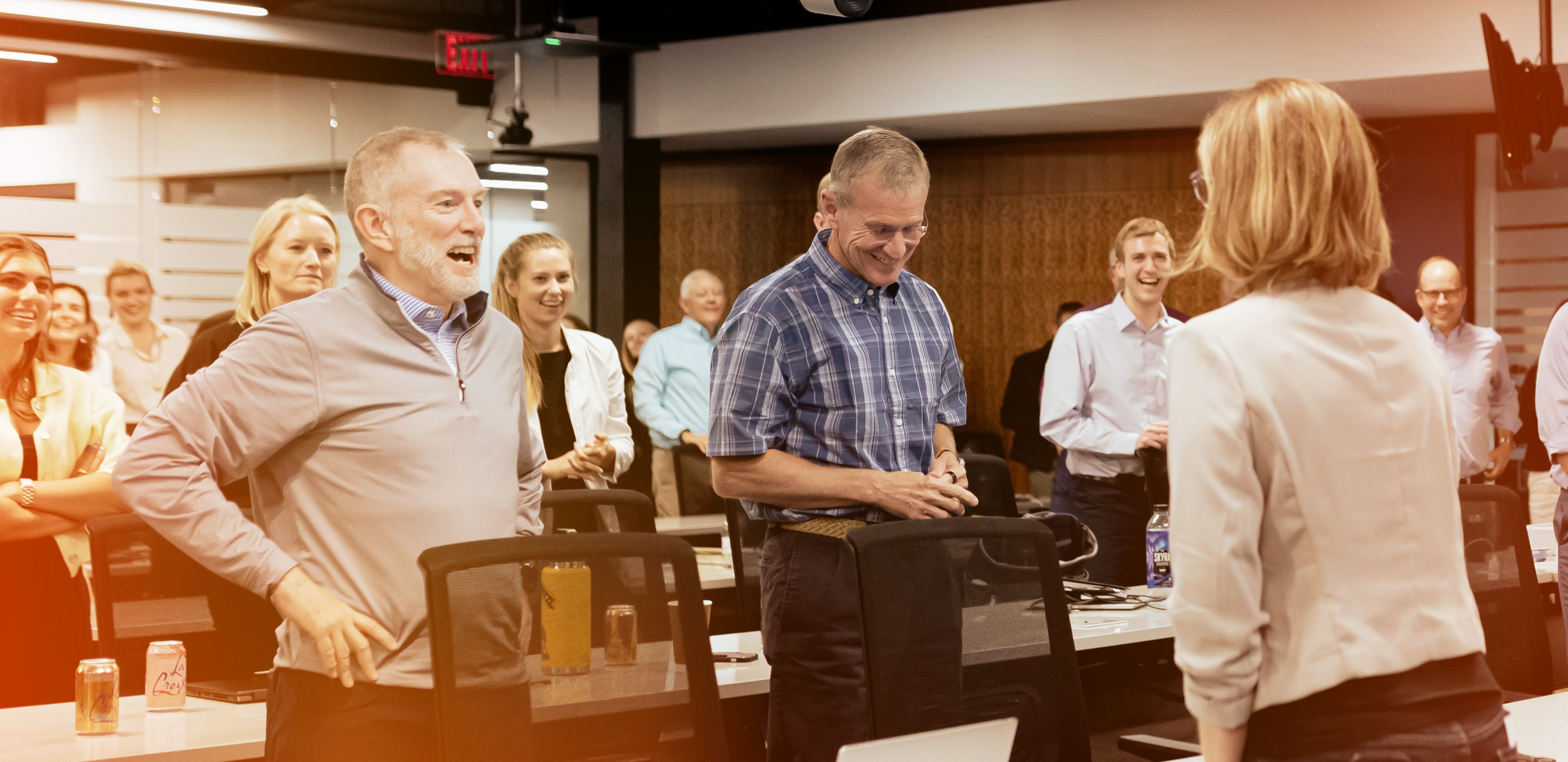 Colleagues Standing in a Room Smiling