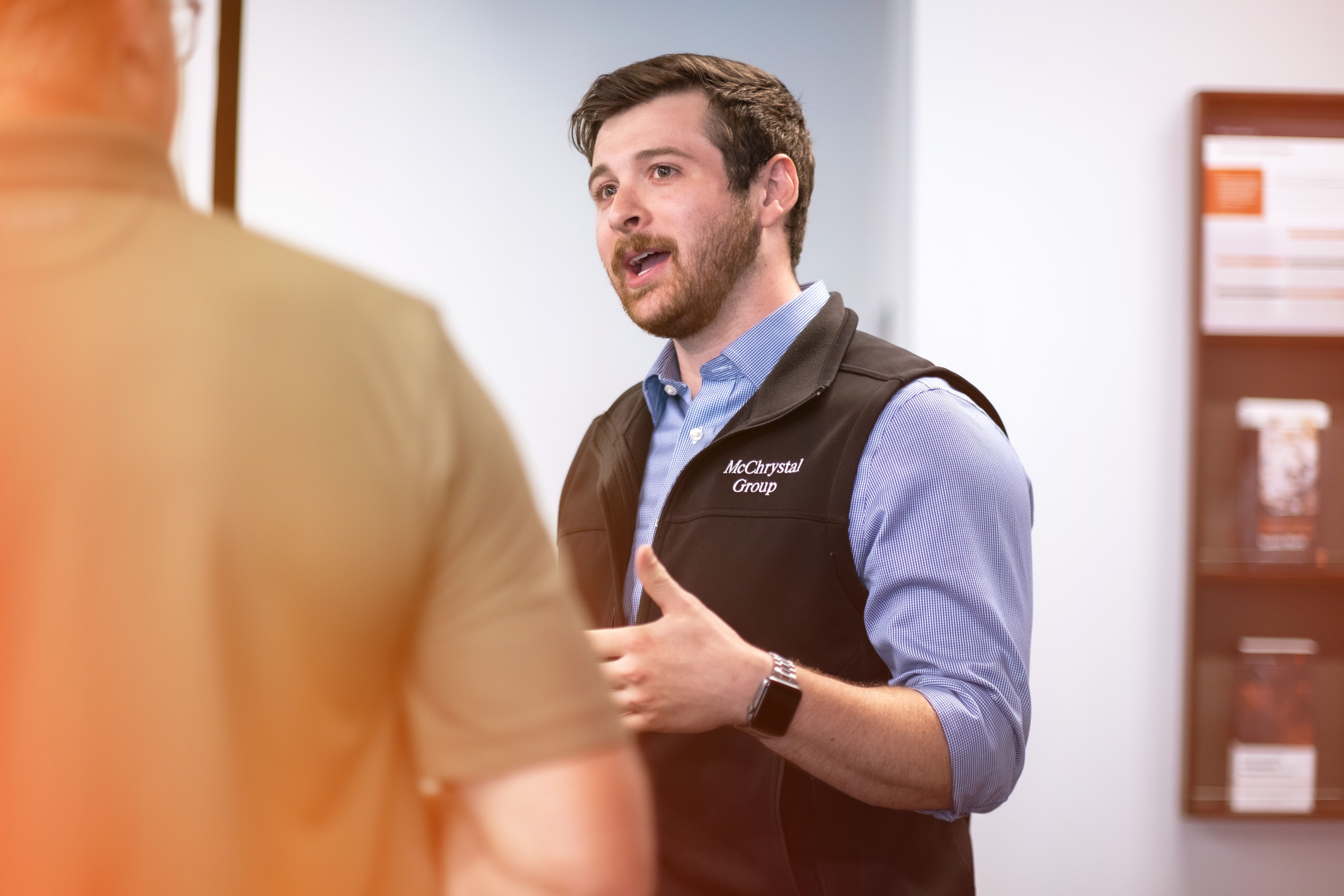 Man Speaking with Colleague