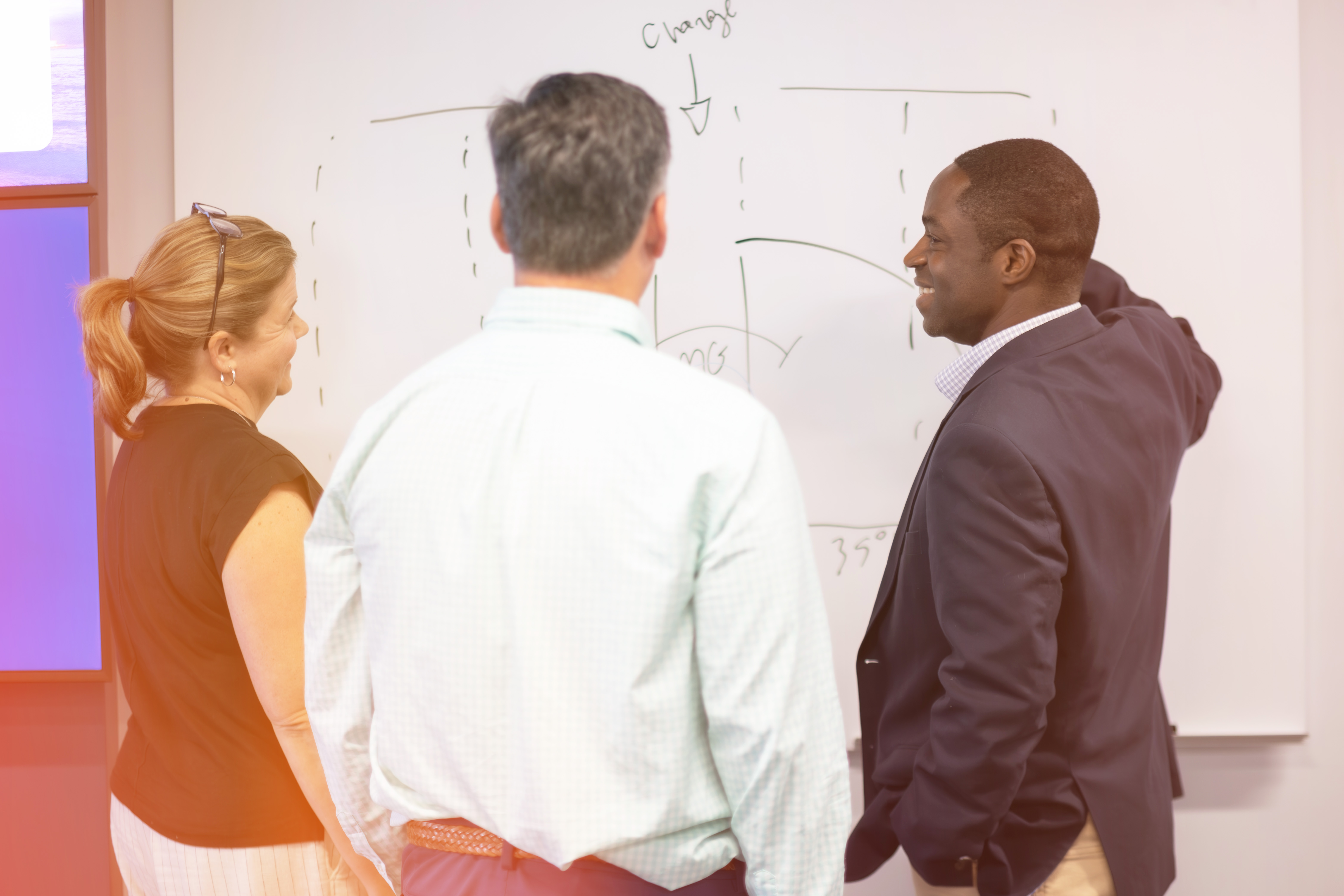 Team of Colleagues at Whiteboard